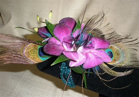 Peacock Feather Corsage | Arabian nights theme party, Arabian nights ...