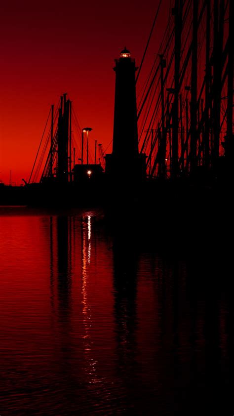 Download wallpaper 1080x1920 lighthouse, boats, masts, pier, night, red ...
