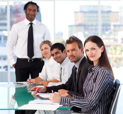 Business people looking at the camera in a meeting | Premium Photo