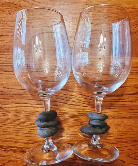 I put stones on my wine glass stems by drilling holes in the stones ...