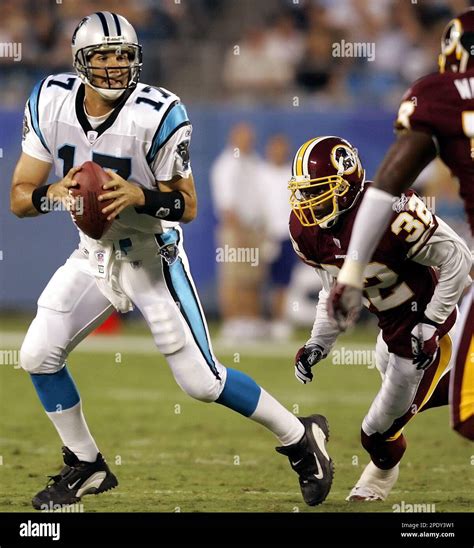 Carolina Panthers quarterback Jake Delhomme (17) scrambles as ...