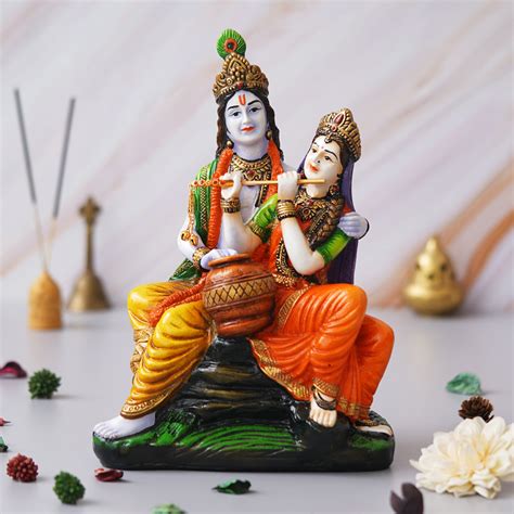 eCraftIndia Multicolor Polyresin Radha Krishna Idol Sitting on Rock Pl