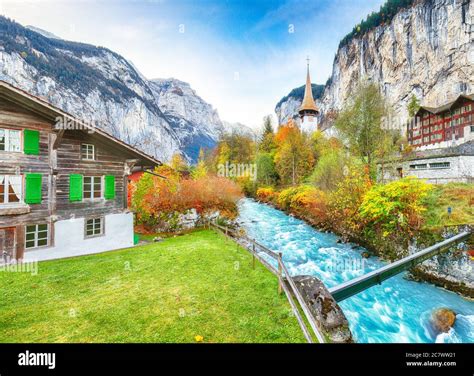 Stunning autumn view of Lauterbrunnen village with awesome waterfall ...