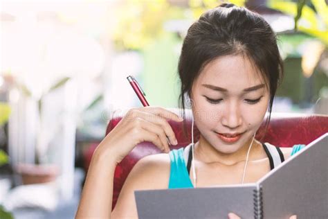 Asian women writing diary stock photo. Image of studying - 118629030