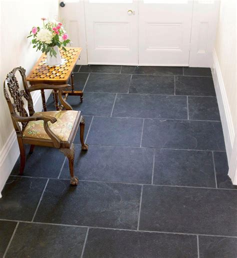 The stylish black riven slate floor tile is a sophisticated option for ...