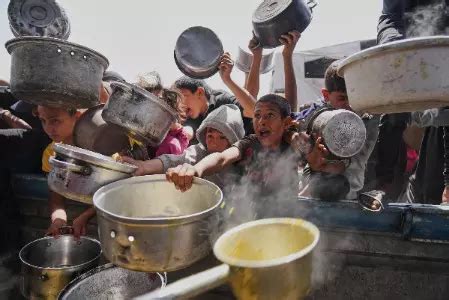 Desperate children, adults in Gaza struggle to get food as Israel ...