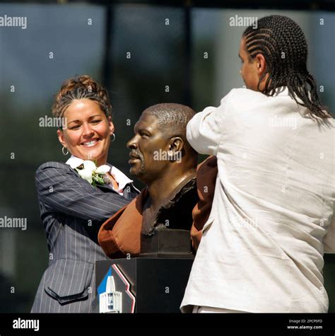 Sara White, left, and her son, Jerermy, unveil the bust of her late ...