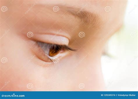 A Young Girl`s Eye Close-up in Profile. a Look Down_ Stock Photo ...