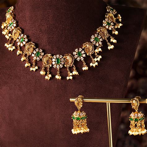 Fish Elegance Floral Pattern Gold Plated Green Stoned Necklace Jhumkis ...