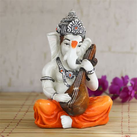 Lord Ganesha playing Guitar Decorative Showpiece - eCraftIndia Online