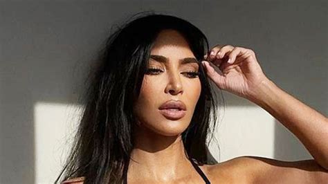 Kim Kardashian leaves fans drooling as she shows off her curves in sexy black thong bikini for ...
