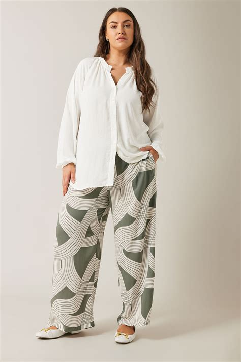 EVANS Plus Size Olive Green Linear Print Wide Leg Trousers | Evans