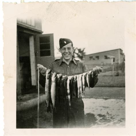 Lt. James Gordon holding a line of fish | The Digital Collections of ...
