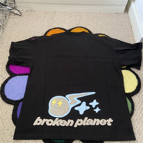Broken Planet Speed Of Light black T shirt Puff... - Depop