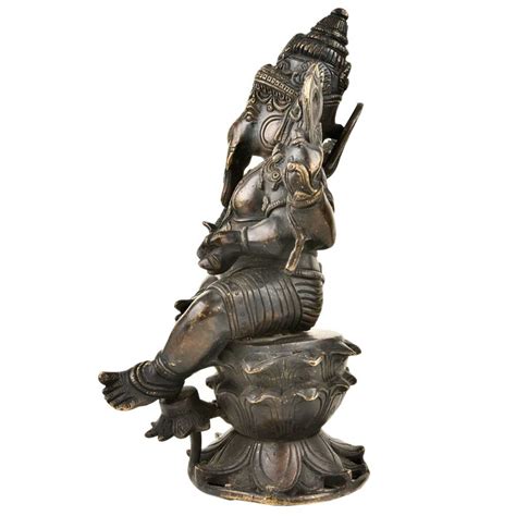 Brass Lord Ganesha seated Relaxed on Lotus Lord With Black Polish