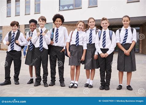 Portrait of High School Student Group Wearing Uniform Standing Outside ...