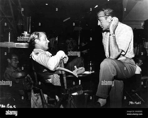 ALAN LADD with Set Visitor GARY COOPER on set candid during filming of ...
