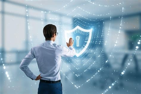 Back view of businessman using glowing polygonal web security shield ...