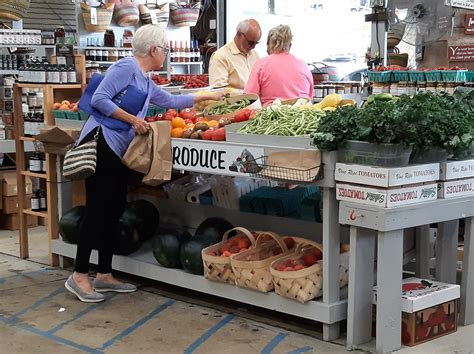 WNC Farmer’s market customer picking produce – Mrs. HomeFree