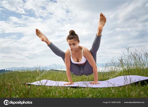 Woman holding balance on hands on yoga mat. — Stock Photo © serhii ...