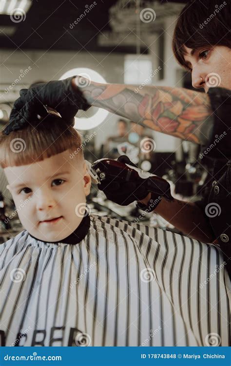 The Process of Cutting a Boy`s Hair in a Barbershop Stock Photo - Image ...
