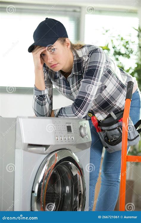 Upset Woman Dealing with Heavy Washing Machine Stock Image - Image of work, young: 266721061