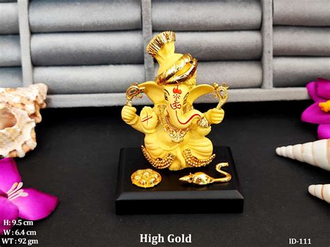Majestic Golden Idol Of Lord Ganesha Seated In Divine Splendor With His ...