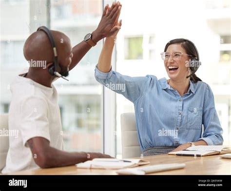 You did a great job well done. two call center workers giving each ...