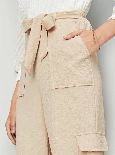 Buy Women Textured Belted Cargo Trousers Online at just Rs. 1199.0 ...