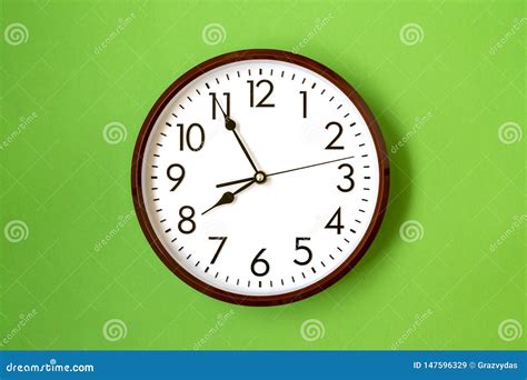 Clock showing 7:55 o`clock stock image. Image of natural - 147596329