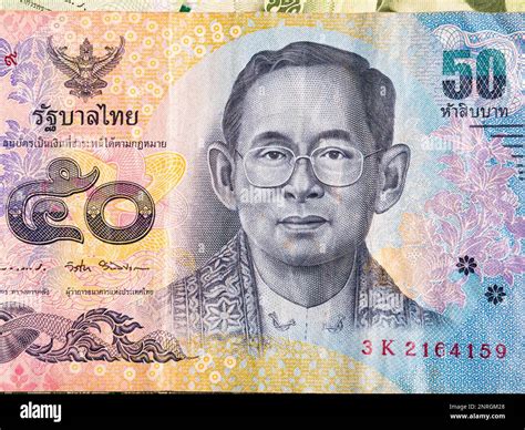 Macro detail with a 50 Thai Baht banknote. the baht is the official currency of Thailand Stock ...
