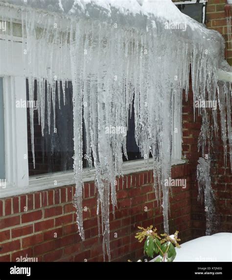 Large icicles are hanging from the roof of the Berkeley Heights Library ...