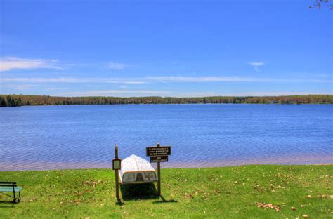 Boat looking out into the lake at Twin Lakes State Park, Michigan image ...