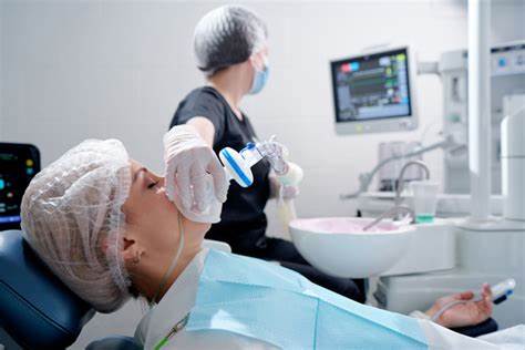 Sedation Dentistry patient under sedation mask - Prasad’s Dental Care