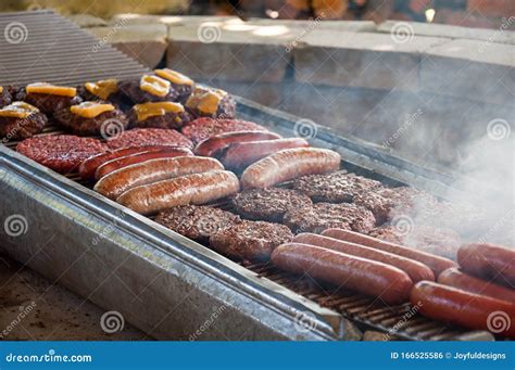 Hot Dogs and Hamburgers Grilling on BBQ Stock Photo - Image of ...