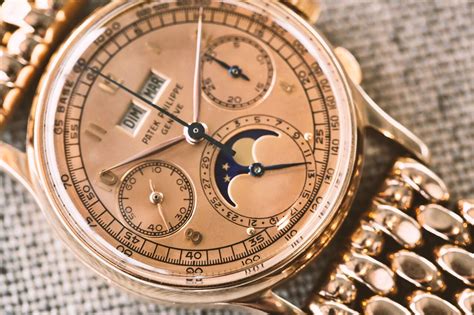 Reference 1518 | A pink gold perpetual calendar chronograph wristwatch ...