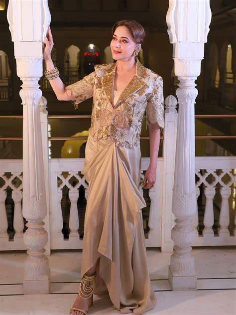 Madhuri Dixit Nene’s ivory Gazal Gupta drape skirt + blazer set took ...