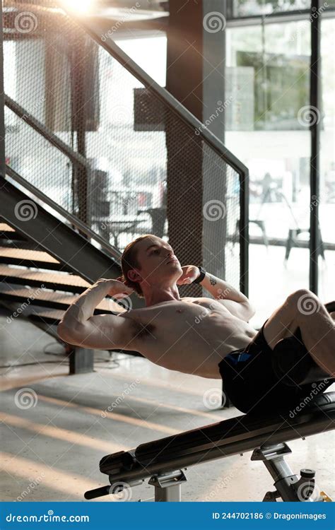 Man Doing Decline Sit-Ups stock photo. Image of sport - 244702186