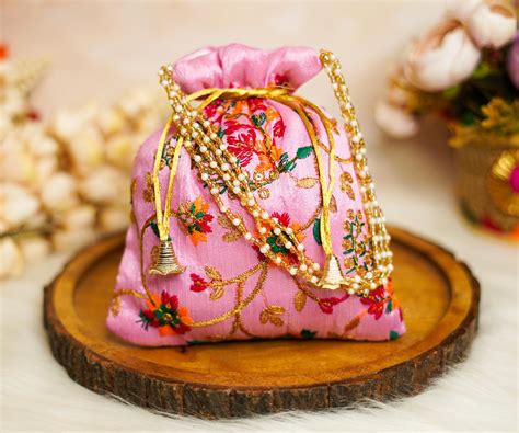 Pink Embroidered Flower Potli with Pearl Handle – Devastram