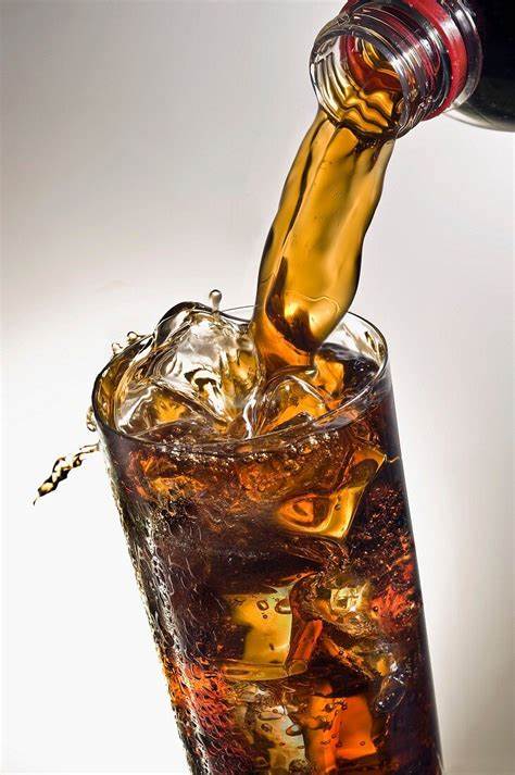 Pouring a glass of Coca-cola with ice … – License image – 60175381 Image Professionals