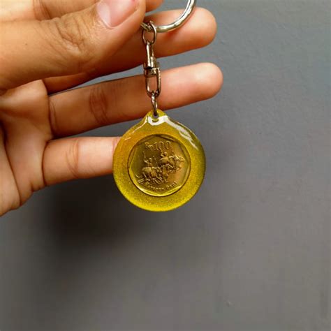 Jual Gantungan Kunci Motif uang kuno 100 karapan sapi,Asli,antik,clasik ...