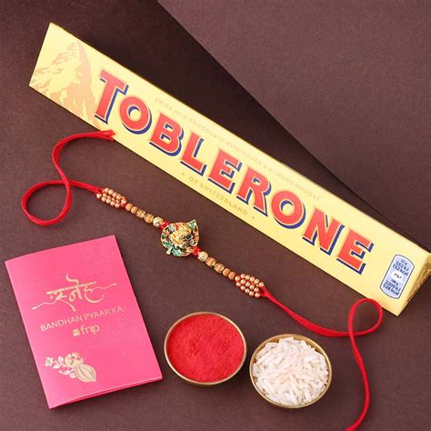 Send Sneh Designer Ganesha Rakhi with Toblerone Chocolate Online