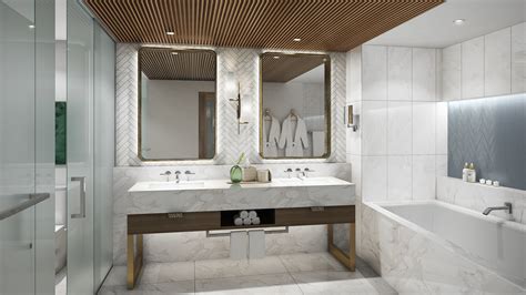 The Ritz-Carlton bath mat hung over standing bathtub