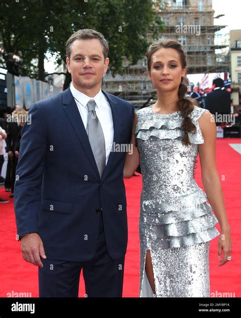 Actors Alicia Vikander, right, and Matt Damon pose for photographers ...