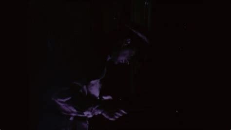 1950s: Night shot of radar antenna rotating on ship. Man looking at ...