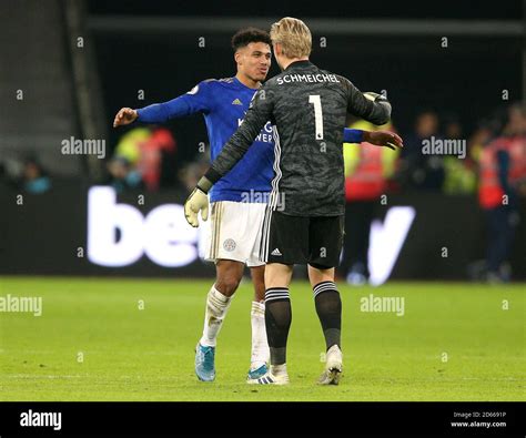 Leicester City's James Justin (left) and goalkeeper Kasper Schmeichel celebrate after the final ...