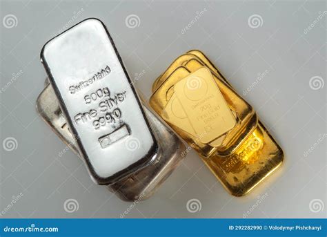 Gold and Silver Bars of Various Weights on a Grey Background Stock ...