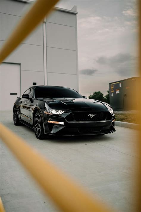 Sleek Black Mustang GT in Urban Setting · Free Stock Photo