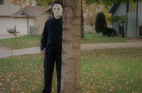 Download Michael Myers Standing By Tree Autumn Scene Wallpaper ...