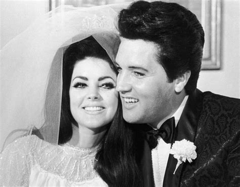 Elvis Presley and his wife, Priscilla hugging each other on their ...